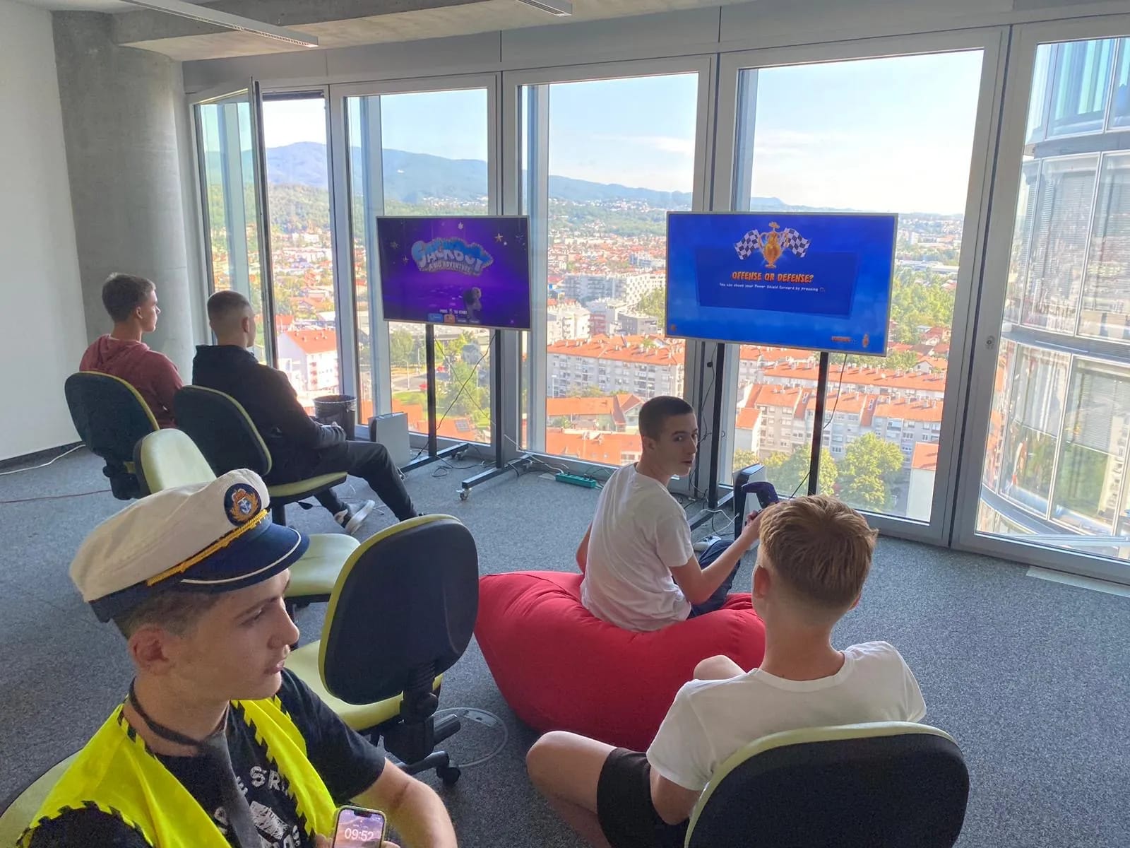 A group of people sitting in chairs in a room